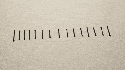 Two groups of short ink ticks on warm paper, with a circle drawn around one group.
