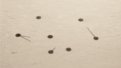 An ink graph of nodes and edges on warm paper, with one dark dot on a node.