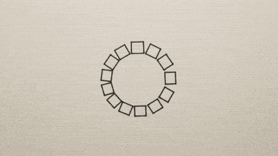 A loop of ink squares on warm paper, some darker than the rest.